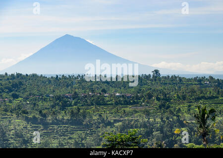 Mount Agung or Gunung Agung is a volcano in Bali in Indonesia, located south east of Mt Batur volcano. Stock Photo