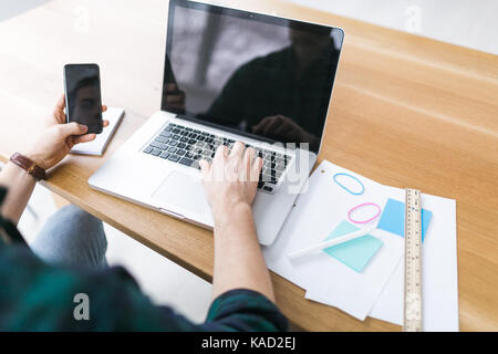 Young businessman working at a table Stock Photo