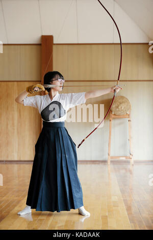 Japanese traditional Kyudo archery athlete practicing Stock Photo