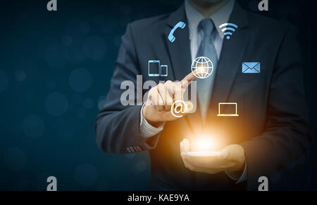 Businessman touch globe icon on hand, communication and connection concept Stock Photo