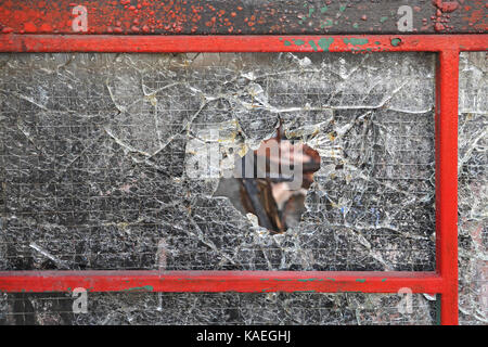 Hole in Tempered Safety Glass Stock Photo