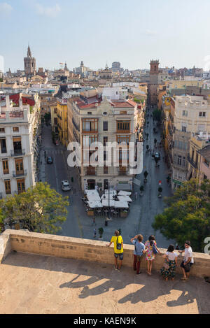 Valencia Spain city view, tourists look down on the old town quarter of Valencia from the ramparts of the medieval Torres Serranos city gate, Spain Stock Photo