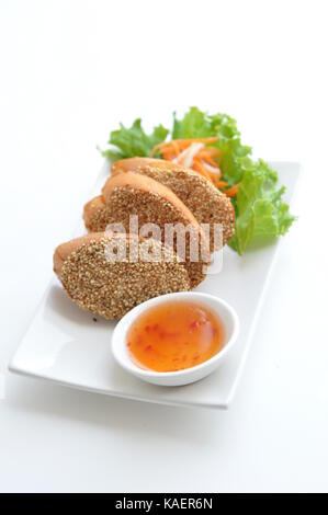 Shrimp Toast. Shrimp paste spread on French bread, deep - fried and served with homemade sauce. Stock Photo