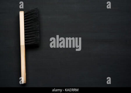 cleaning brush on dark wooden background with copy space Stock Photo