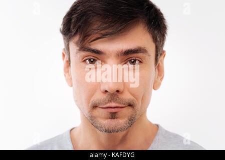 Close up of handsome black-haired bristled man Stock Photo