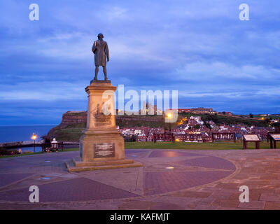 Captain Cook Statue on West Cliff at Dusk Whitby Yorkshire England Stock Photo