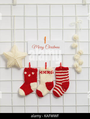 Christmas sdecorations hanging on a grid. Stock Photo