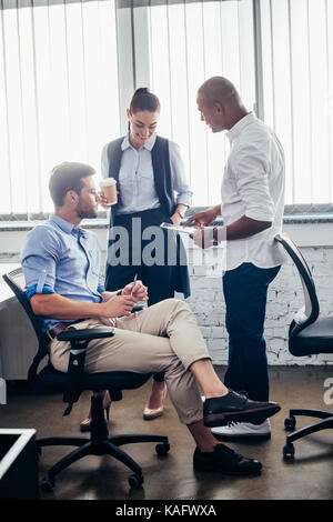 multiethnic colleagues discussing in office  Stock Photo