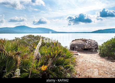 World war two bunker on Sardinia's coast in a cloudy day Stock Photo