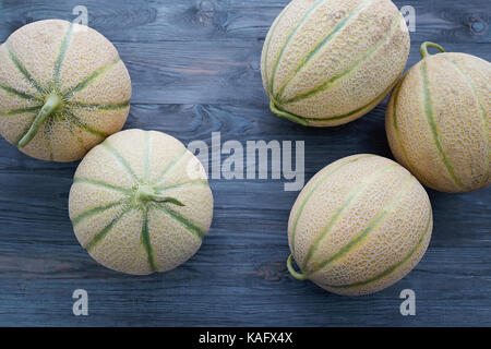 High Angle View Of Fresh Cantaloupe On Wooden Table. Stock Photo