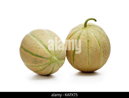 Two fresh cantaloupe melons on white background. Stock Photo