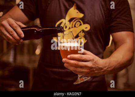 Torrevieja, Spain - August 16, 2017: Man pouring beer to the glass Stock Photo