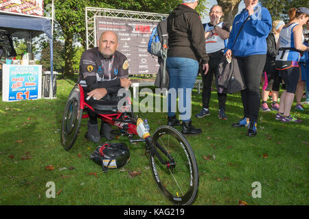 Disabled ex-serviceman Ste Hughes sits in his specially adapted wheelchair prior to completing the English Half Marathon in Warrington, Cheshire, Engl Stock Photo