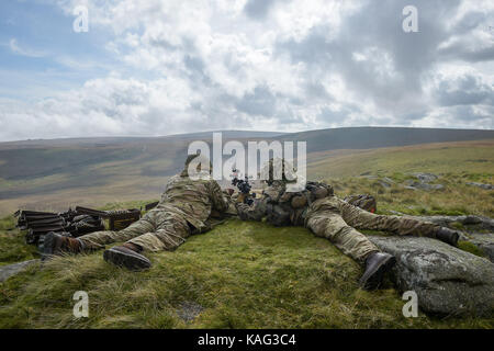 Soldiers from 6 RIFLES fire live ammunition from a General Purpose Machine Gun (GPMG) on the range at Okehampton Camp, Dartmoor, during the 6th Battalion, The Rifles' Annual Deployment Exercise. Stock Photo