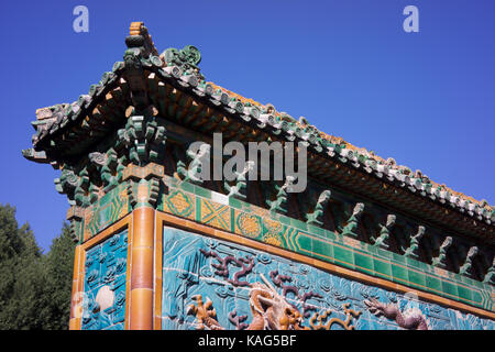 The eaves of nine-dragon wall at Beihai park in Beijing Stock Photo