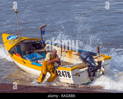 Crab fishermen landing boat at Sheringham  Norfolk Stock Photo