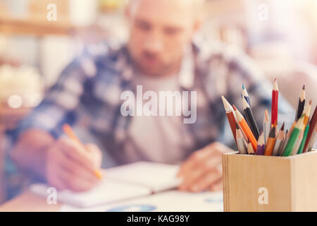 Young male freelancer working from home Stock Photo