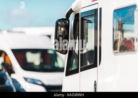 RV Park Camper Van Closeup Photo. Recreational Vehicles Parking. Vacation and Travel Industry Concept. Stock Photo