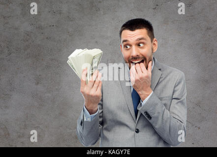 greedy businessman with american dollar money Stock Photo