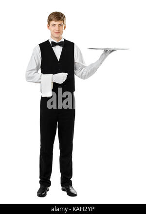 Full length portrait of handsome elegant waiter holding empty silver tray isolated on white background Stock Photo