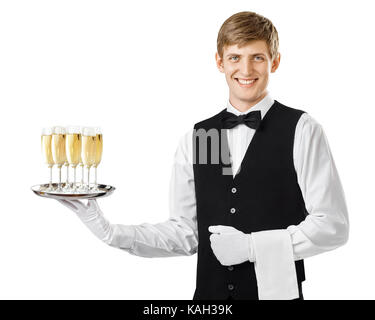 Portrait of young happy smiling waiter serving champagne on a tray isolated on white background Stock Photo