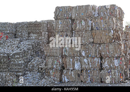 Paper and carboard carton material stacked for recycling Stock Photo
