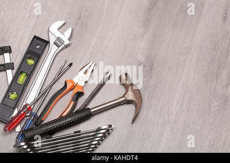 Differents tools on grey wooden table Stock Photo