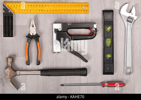 Tool kit on grey wooden desk Stock Photo