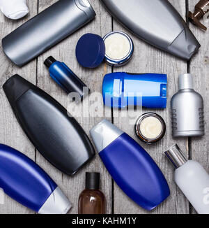 Mens cosmetics. Various cosmetic products for men on old wooden planks Stock Photo