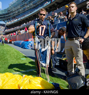 September 24, 2017: Chicago, Illinois, U.S. - A member of the US Navy Leap Frogs detaches his gear after landing on the field before the NFL Game between the Pittsburgh Steelers and Chicago Bears at Soldier Field in Chicago, IL. Photographer: Mike Wulf Stock Photo