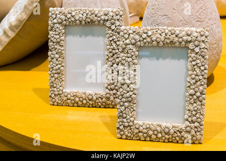 two empty photo frames on table Stock Photo