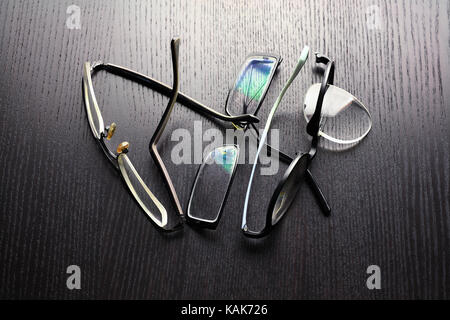 Broken Eyeglasses on Wooden Background Stock Photo