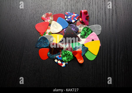 Guitar Plectrums on Wooden Background Stock Photo