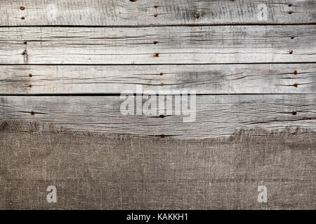 Burlap on old gray wooden background. Studio shot, high quality Stock Photo