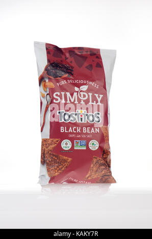 Bag of Simply Black Bean Tostitos  with sea salt by Frito Lay with no artificial colors, flavors or preservatives on white background, cut out USA. Stock Photo