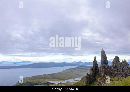 Grey summer mist passes over the Old Man of Storr on the Isle of Skye in Scotland. Stock Photo