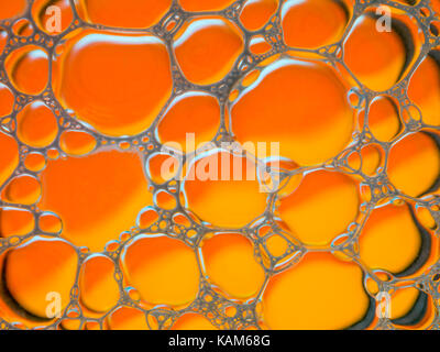 soap bubbles orange liquid background Stock Photo