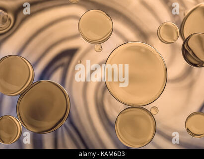 vintage image with drops of golden oil on spiral background Stock Photo