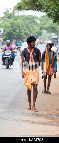 PONDICHERY, PUDUCHERY, INDIA - AUGUST 28, 2017. Unidentified christians, catholics, hinduists people, with orange dress, pilgrims walk from chennai to Stock Photo