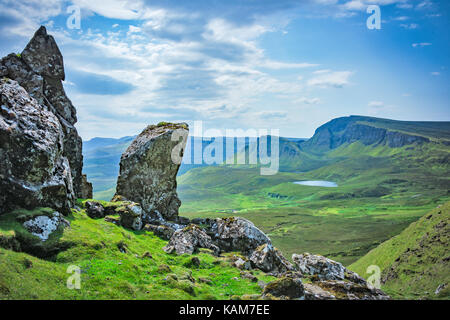 A view from the Quiraing on the Isle of Skye with a rocky formation in the foreground Stock Photo