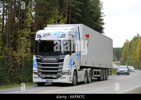 LAUKAA, FINLAND - SEPTEMBER 22, 2017: White Next Generation Scania R500 semi truck on a test drive on rural autumn highway during Scania Laukaa Tupasw Stock Photo