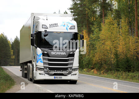 LAUKAA, FINLAND - SEPTEMBER 22, 2017: White Next Generation Scania R500 semi truck on a test drive along autumnal highway during Scania Laukaa Tupaswi Stock Photo