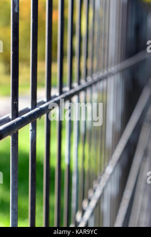 Close up of iron fence. Focus on foreground, vertical image. Stock Photo