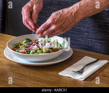 Healthy eating,Evening meal including five-a-day,Salad with fresh vegetable ingredients - lettuce,carrots,avocado pear,onions,tomotoes,cucumbers Stock Photo