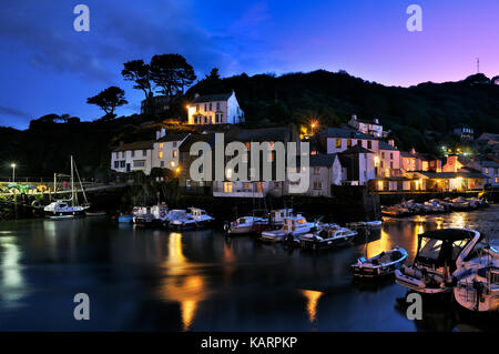 Polperro, Cornwall. Unfailingly busy on summer days, the sleepy Cornish fishing village returns to an atmospheric calm at twilight... Stock Photo