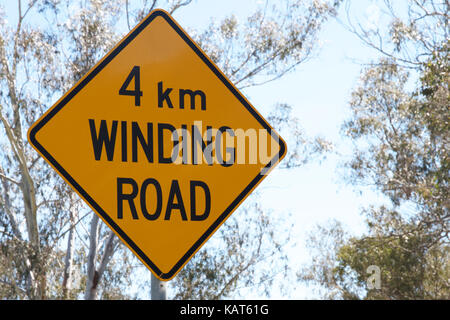 4km Winding road signage. Stock Photo