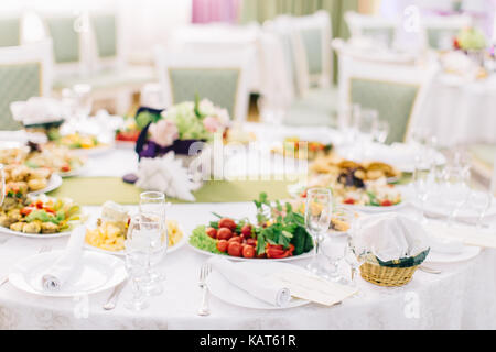 Beautifully decorated catering banquet table on corporate christmas birthday party event or wedding celebration Stock Photo