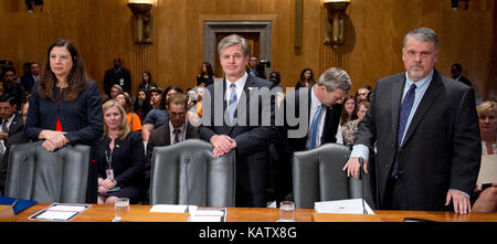 From left to right: Acting United States Secretary of Homeland Security Elaine C. Duke; Christopher A. Wray Director, Federal Bureau of Investigation (FBI); and Nicholas J. Rasmussen, Director, National Counterterrorism Center, Office of the Director of National Intelligence, wait to testify before the United States Senate Committee Homeland Security and Governmental Affairs on 'Threats to the Homeland' on Capitol Hill in Washington, DC on Wednesday, September 27, 2017. Credit: Ron Sachs/CNP /MediaPunch Stock Photo