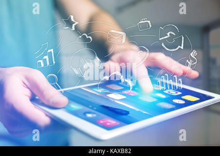 View of Hand drawn business icon going out a tablet interface of man at the office - Business concept Stock Photo