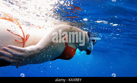 Woman dive underwater in snorkeling diving mask Stock Photo
